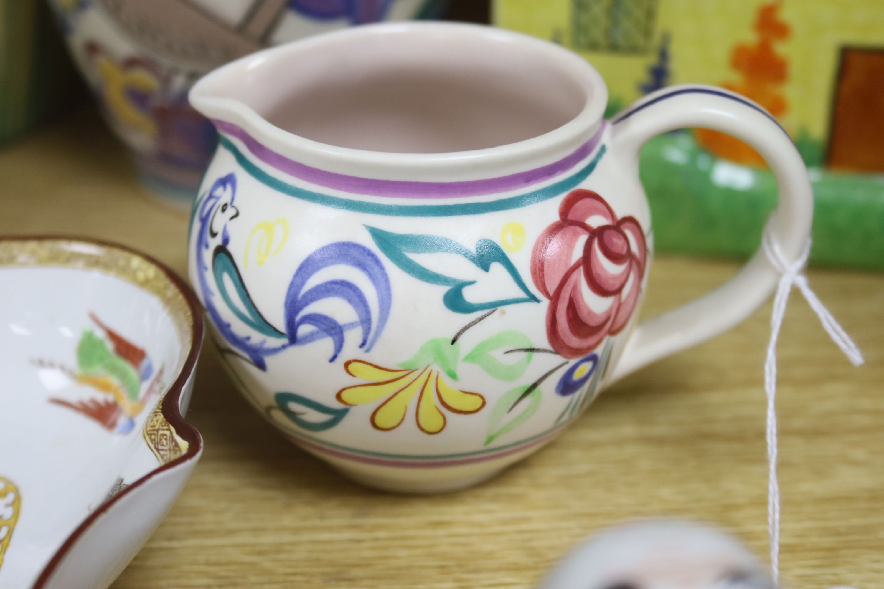 A Carltonware biscuit barrel, Poole polychrome, Beswick, Doulton ware, etc.